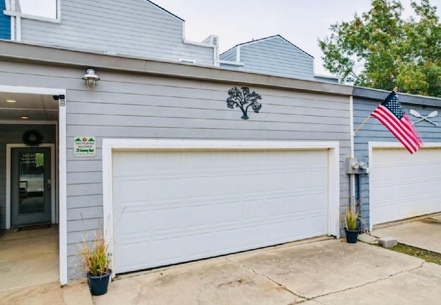garage with concrete driveway