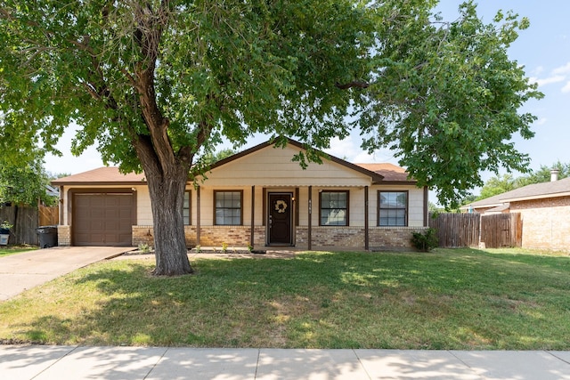 view of front facade with a garage and a front lawn