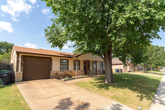 single story home featuring a garage, brick siding, fence, driveway, and a front yard