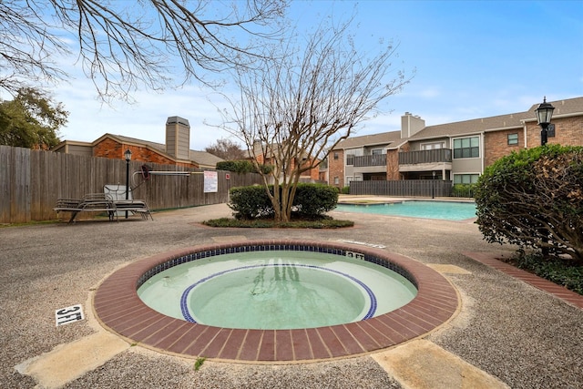 view of pool featuring a community hot tub