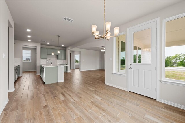 9 Louis Rd, Sherman, TX 75090 - kitchen featuring open floor plan, light wood-type flooring, light countertops, gray cabinetry, and recessed lighting