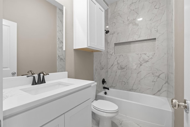 full bathroom featuring tiled shower / bath, vanity, and toilet