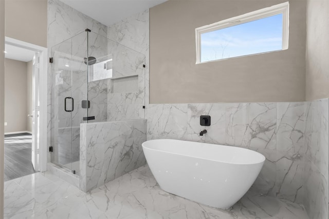 bathroom with shower with separate bathtub