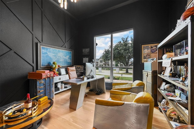 office space featuring crown molding and light wood-type flooring