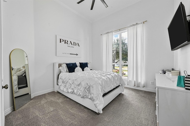 bedroom featuring dark colored carpet, ornamental molding, and ceiling fan
