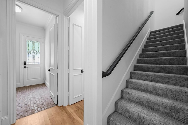 stairway with crown molding