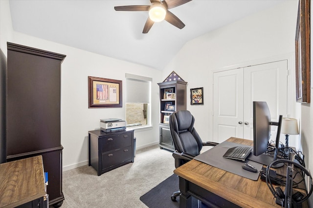 carpeted office space with ceiling fan and lofted ceiling