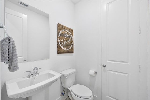 bathroom with sink and toilet