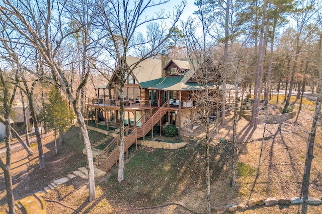 view of playground with a wooden deck