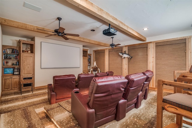 home theater with ceiling fan and beam ceiling