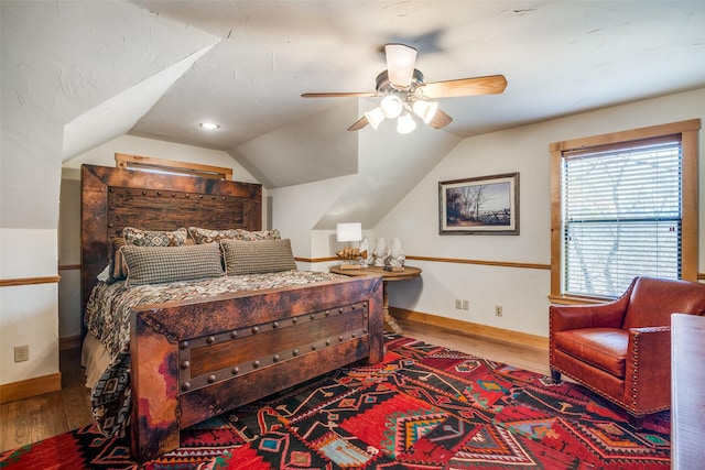 bedroom featuring wood-type flooring and vaulted ceiling