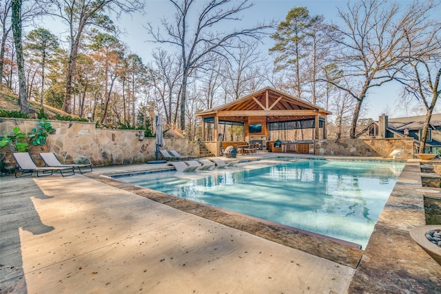 view of swimming pool with a gazebo and a patio