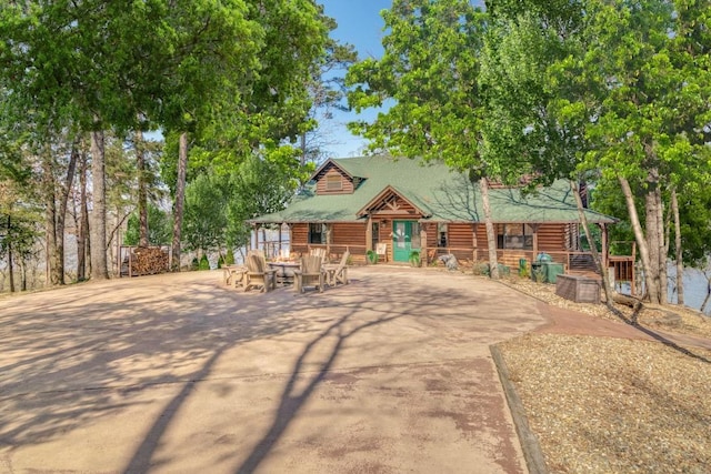 206 Dogwood Pt, Winnsboro, TX 75494 - log home featuring covered porch and log siding
