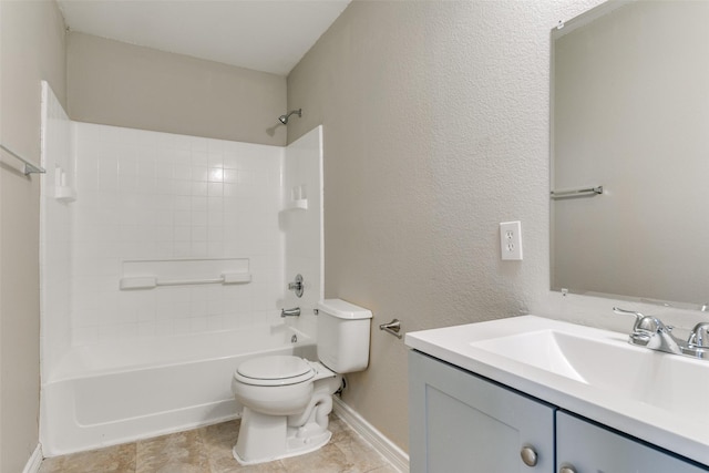 full bathroom with  shower combination, vanity, and toilet