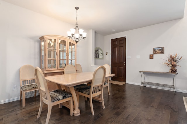 dining space with a notable chandelier and dark wood-type flooring