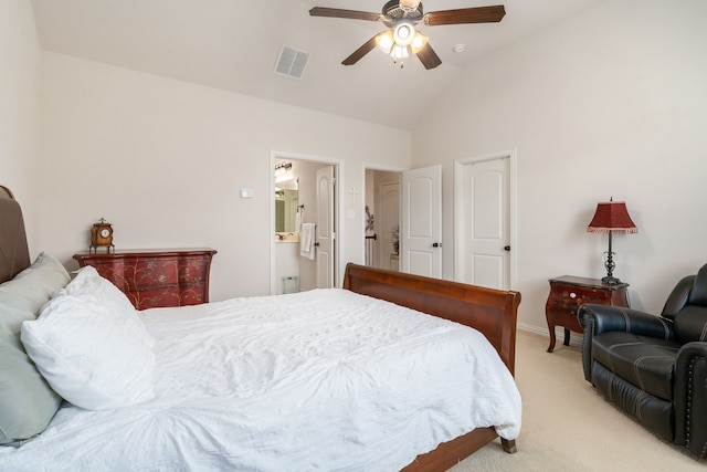 bedroom featuring ensuite bathroom, vaulted ceiling, ceiling fan, and light colored carpet