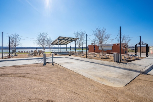 view of playground with a water view