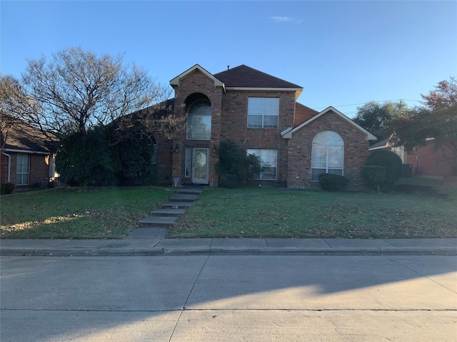 front facade with a front lawn