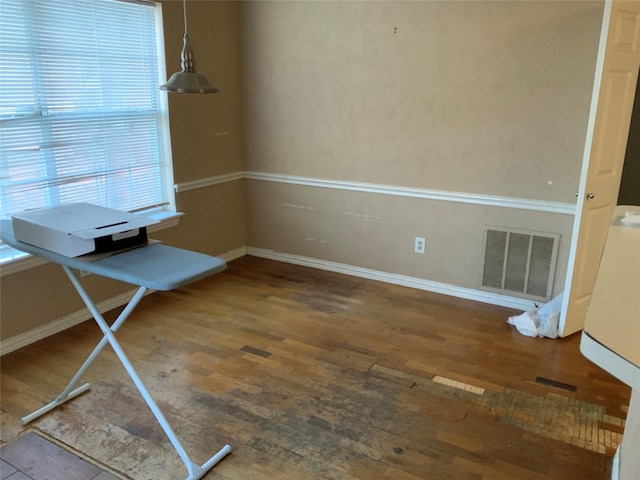 unfurnished office featuring hardwood / wood-style flooring