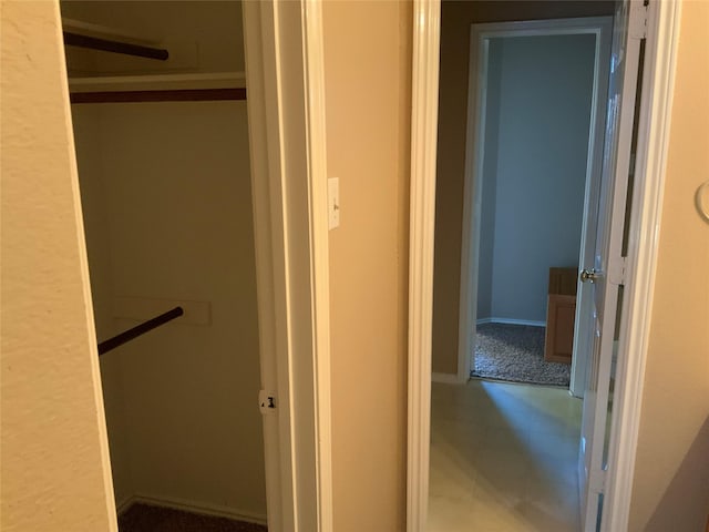 hallway featuring tile patterned flooring