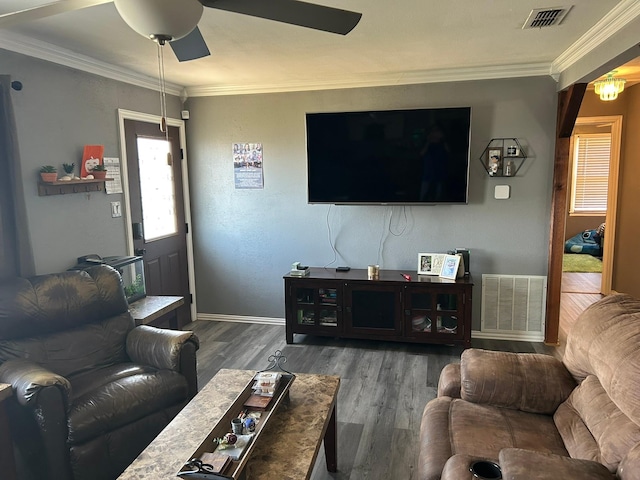 living room with ornamental molding, dark hardwood / wood-style floors, and ceiling fan