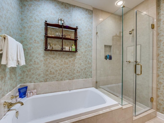 bathroom featuring shower with separate bathtub