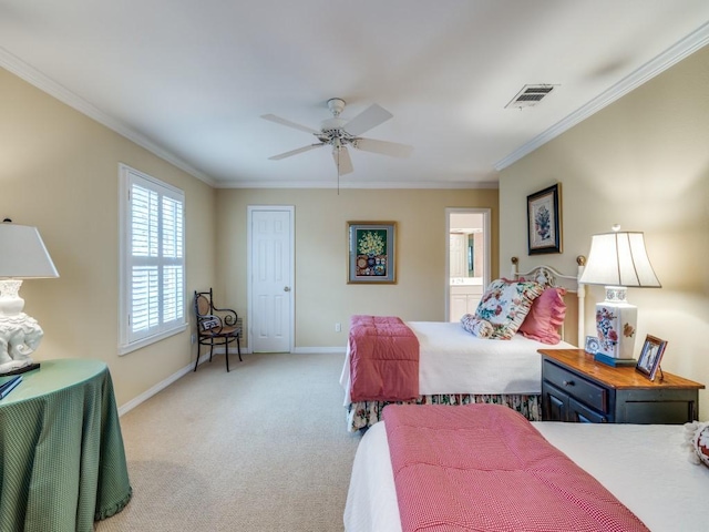 carpeted bedroom with crown molding, ensuite bathroom, and ceiling fan