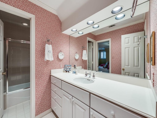 bathroom featuring vanity, crown molding, tile patterned floors, and shower / bath combination with glass door