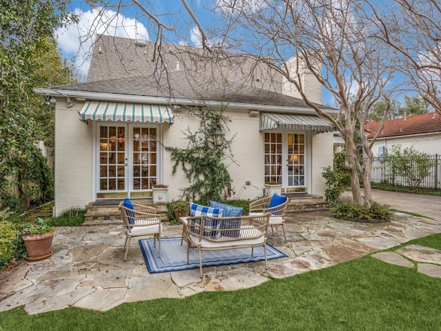 back of house with a patio and french doors