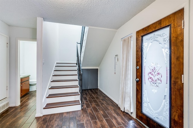 entrance foyer with a textured ceiling