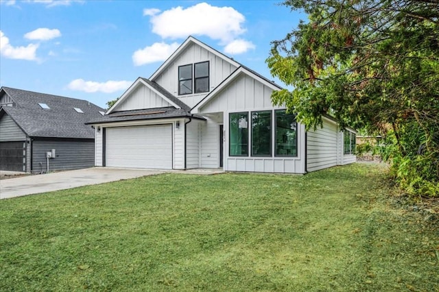 view of front of house with a garage and a front lawn