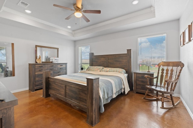 bedroom with crown molding, ceiling fan, and a tray ceiling