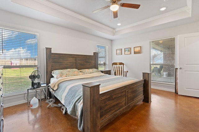 bedroom featuring crown molding, ceiling fan, and a raised ceiling