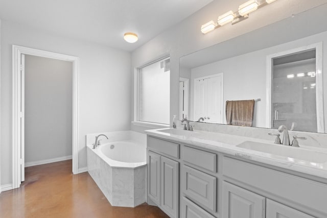 bathroom with vanity and separate shower and tub