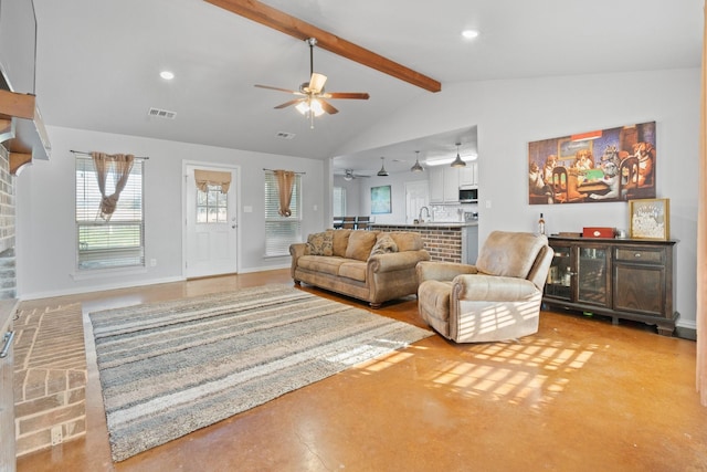 living room featuring ceiling fan, high vaulted ceiling, sink, and beam ceiling