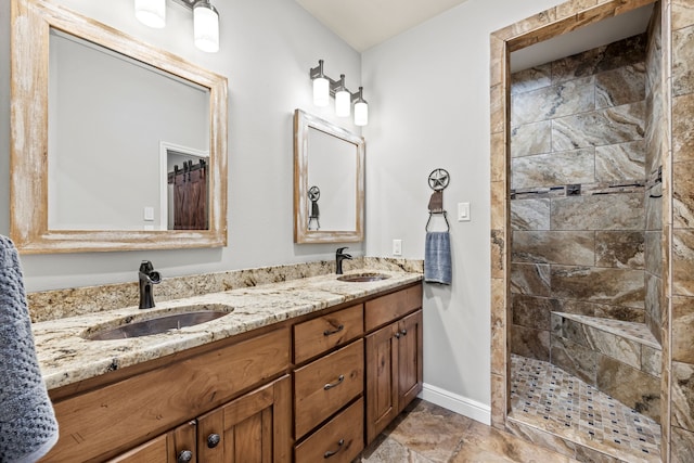 bathroom with vanity and tiled shower