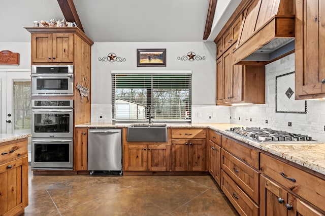 kitchen featuring stainless steel appliances, custom exhaust hood, light stone countertops, and decorative backsplash