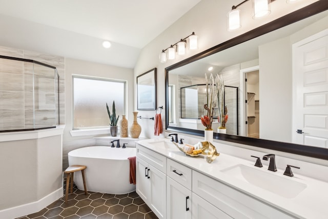 bathroom with vanity, tile patterned flooring, vaulted ceiling, and separate shower and tub