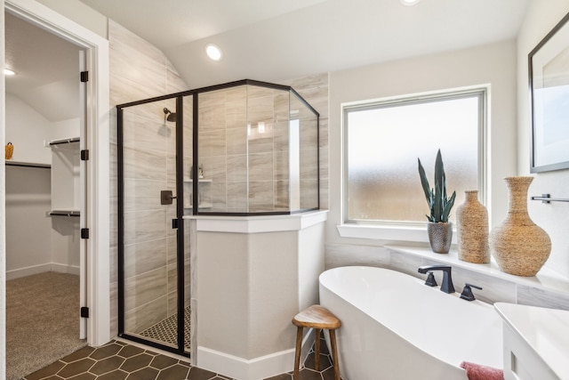 bathroom with independent shower and bath and lofted ceiling