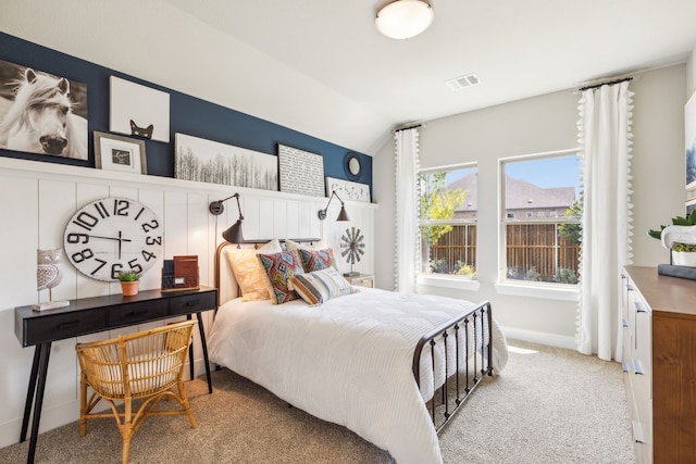 bedroom with lofted ceiling and carpet flooring