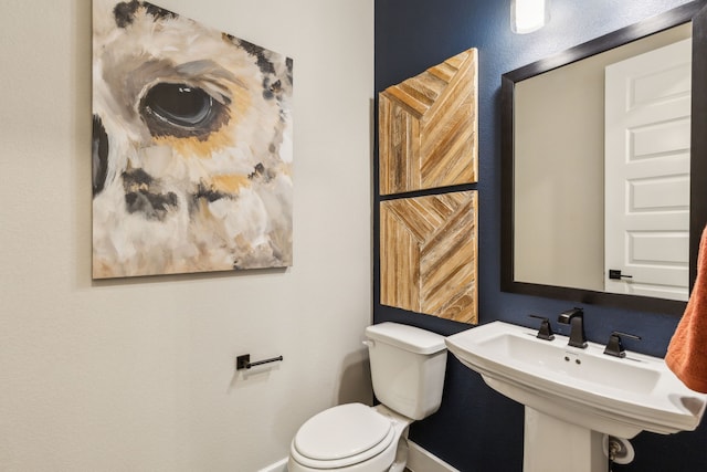 bathroom featuring sink and toilet