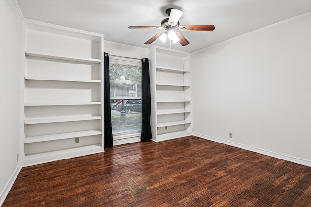 empty room featuring dark wood-type flooring, ceiling fan, and crown molding