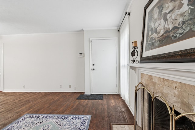 entryway with crown molding and dark hardwood / wood-style flooring