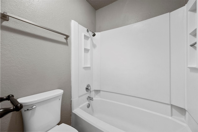 bathroom with shower / bathing tub combination and toilet