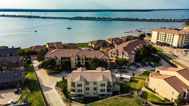drone / aerial view featuring a water view and a residential view