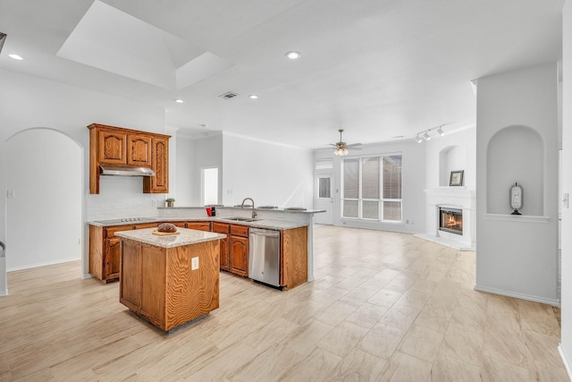 kitchen featuring sink, a center island, stainless steel dishwasher, kitchen peninsula, and black electric cooktop