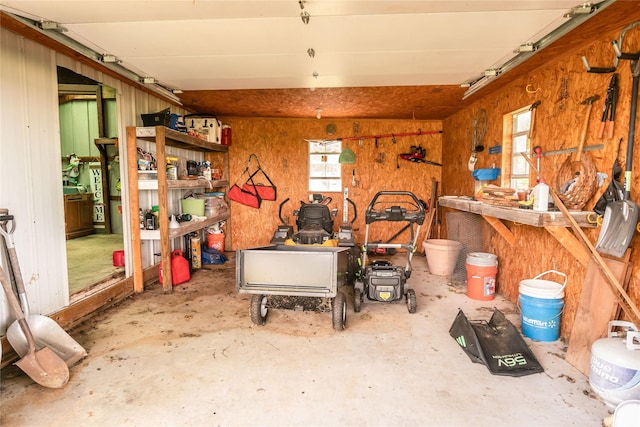 interior space with concrete flooring and a workshop area