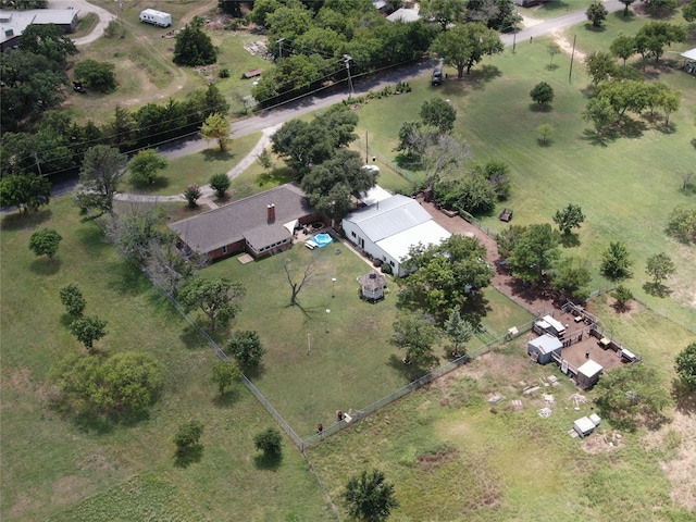 birds eye view of property with a rural view