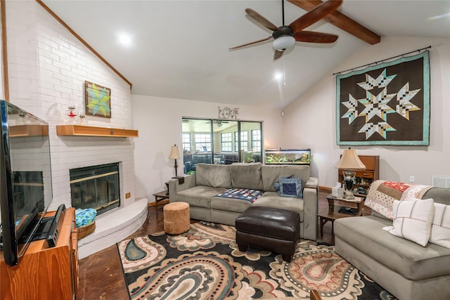 living room featuring lofted ceiling with beams, wood-type flooring, a brick fireplace, and ceiling fan