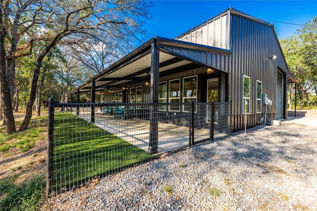 view of side of property featuring an outbuilding